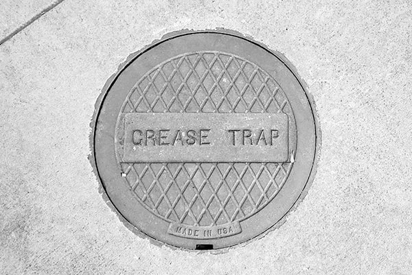 the process for maintaining a grease trap is through regular grease trap pumping to remove built-up grease and prevent clogs